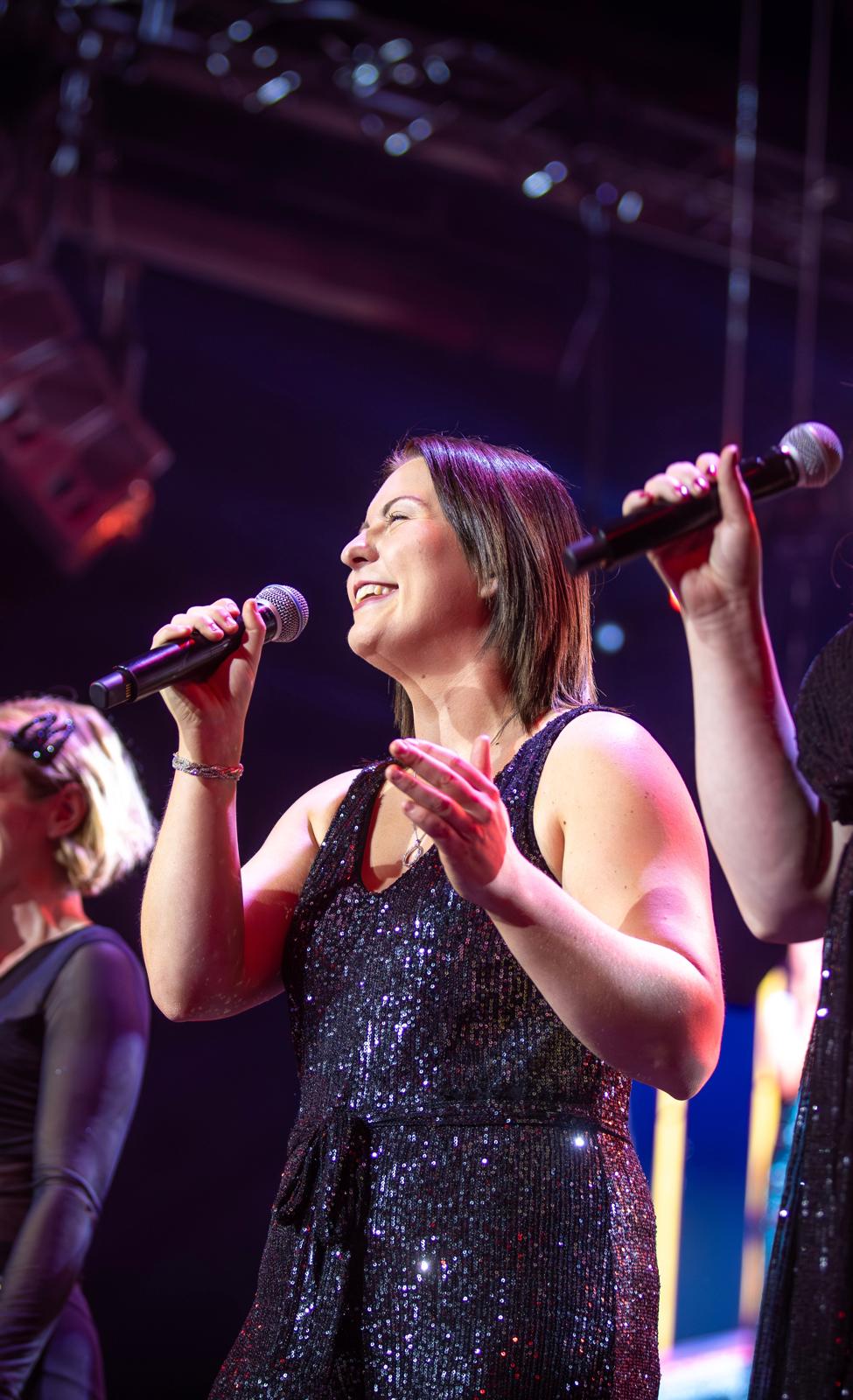 Chloe performing live on stage