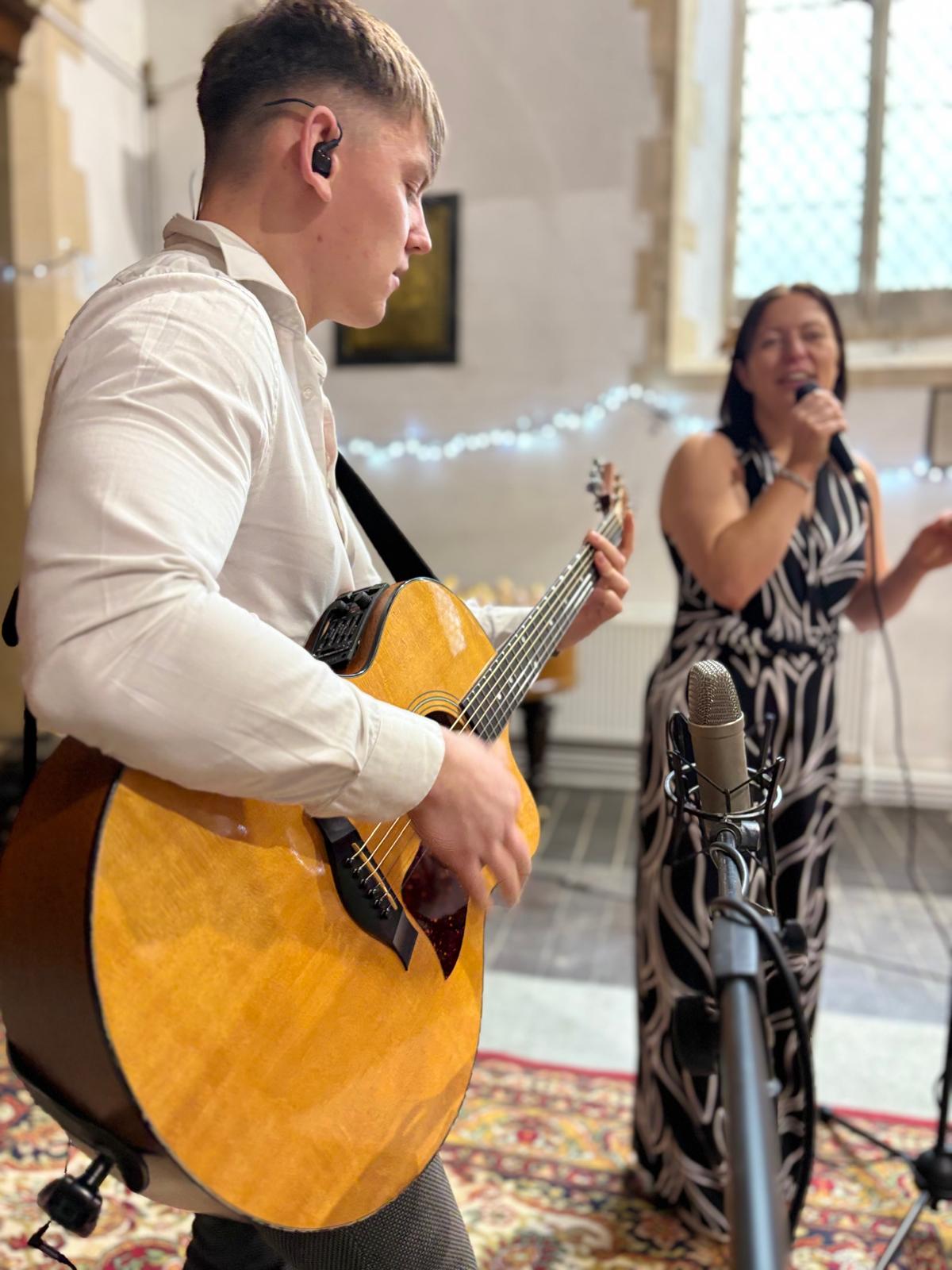 Sam with acoustic guitar